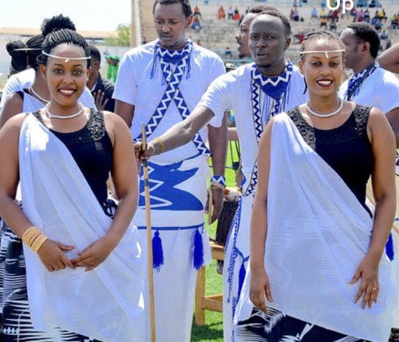 Rwandan cultural performers in elegant traditional Umushanana attire at creative showcase