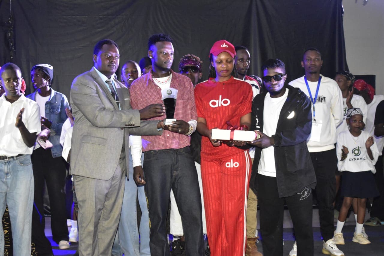 RFM leadership presenting award trophy and recognition to emerging youth musicians on stage