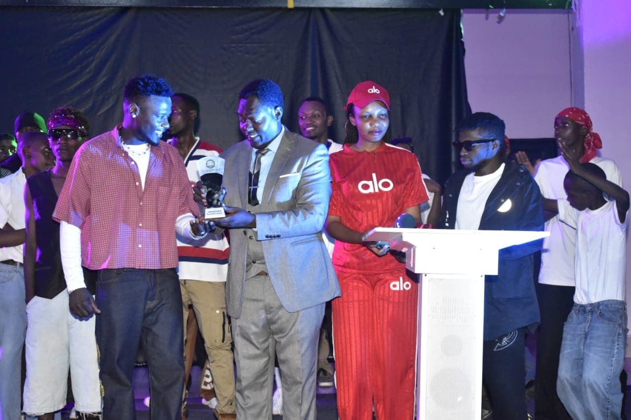 Podium trophy presentation by RFM representative Mutasire Eric to young talent